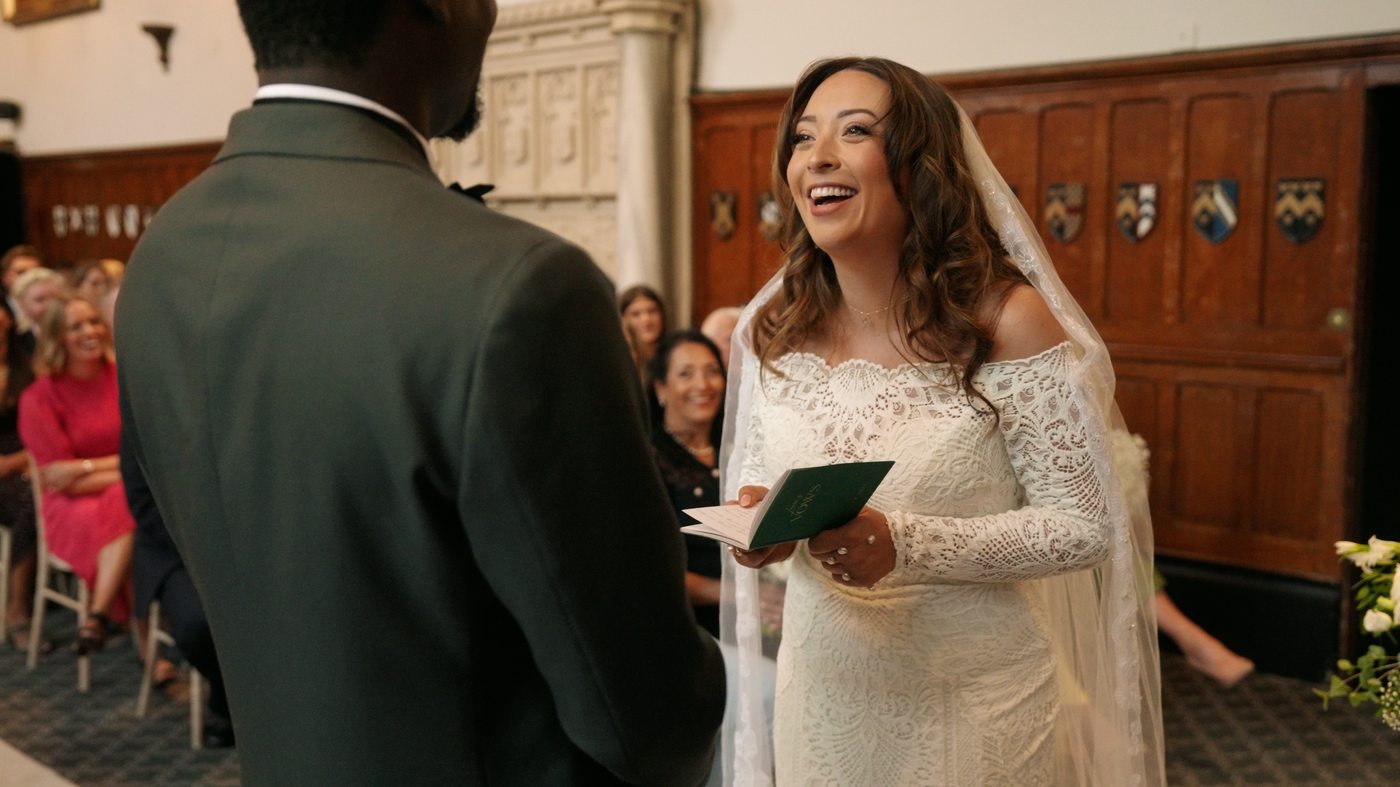Bride laughing at the altar - natural wedding film by Steer Media