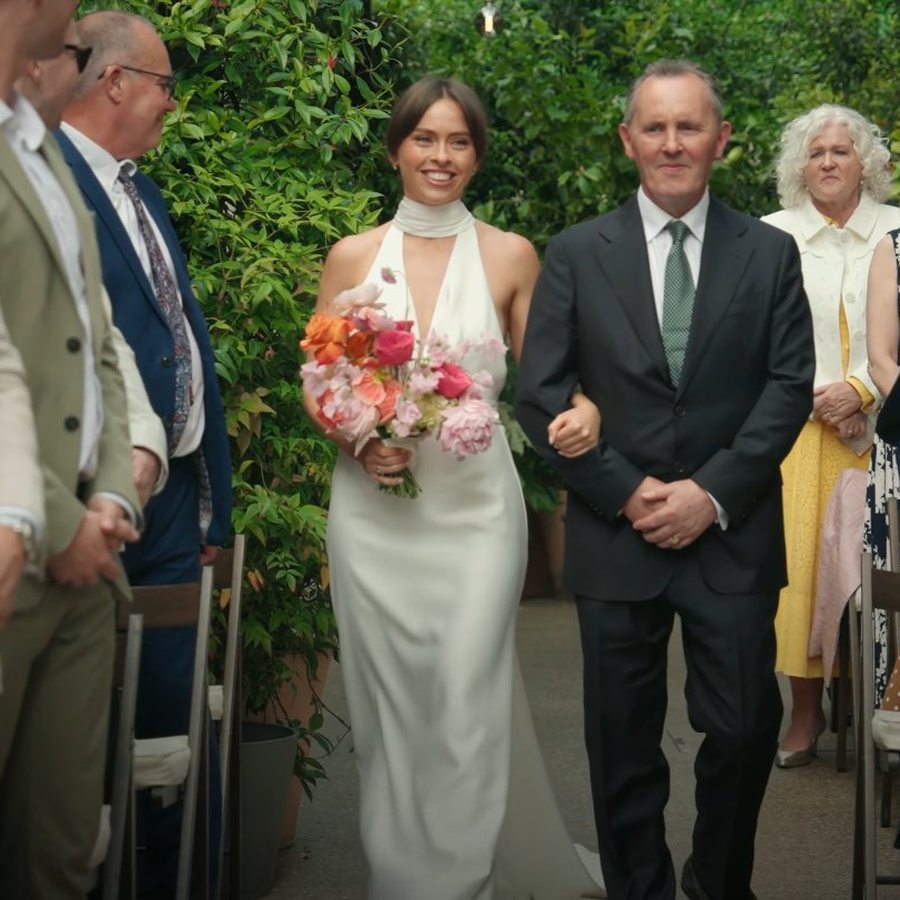 Bride walking down the aisle - natural wedding videography by Steer Media